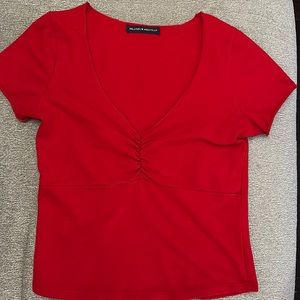 Brandy Melville crunched v-neck tee shirt.  Roll at sleeves.  Size OS.